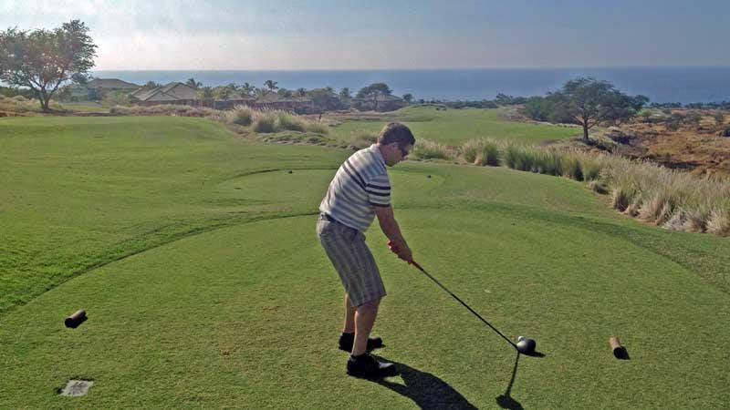 Hawaii Tee Times Staff member hitting off on 11th at Hapuna