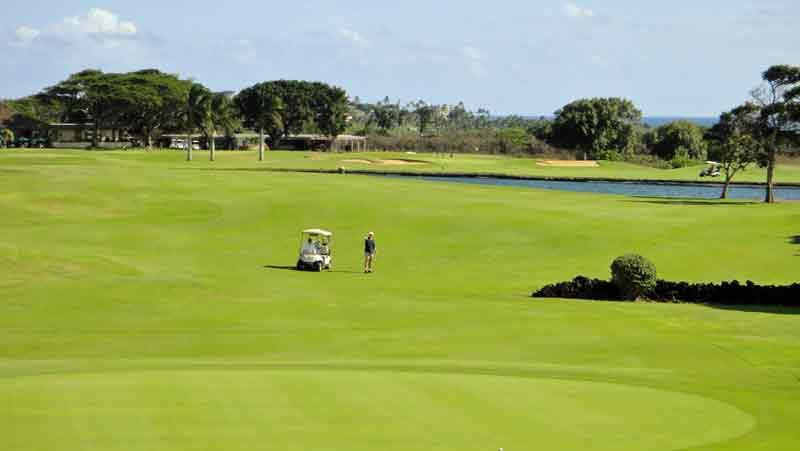 Approaching 10th green with clubhouse and hole 18 in background