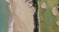 Overhead view of a beachfront green and bunkers at Kaanapali Royal Course
