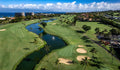 Aerial view of fairways, bunkers and a pond at Kaanapali Royal Course