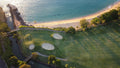 Aerial view of a green and bunkers beside the beach at Kaanapali Royal Course