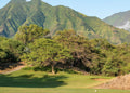 Fairway beneath a mountain backdrop at The Dunes at Maui Lani