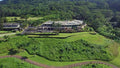 Clubhouse surrounded by lush fairways at Royal Hawaiian Golf Club