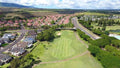 Aerial view of a fairway beside homes at Waikele Country Club