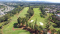 Aerial view of a green and surrounding fairways at Mililani Golf Club